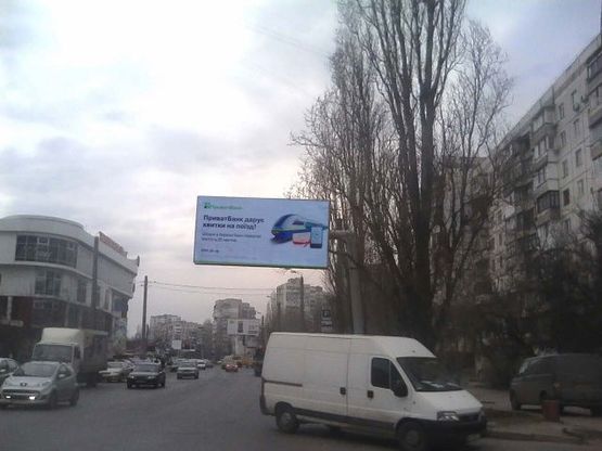 Фото рекламной плоскости по адресу Вильямса ул., 62/1 - 100 м. до Королева ул. (возле ТЦ "Таировский")