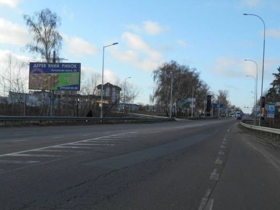 Фото рекламной плоскости по адресу м. Буча, траса М07, км 30+050 ліво, вул. Нове Шосе, біля ТЦ Модуль, Нова Лінія, ЕКО Маркет