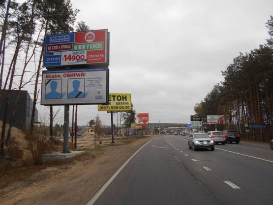 Фото рекламної площини за адресою м. Буча, траса М07, км 24+100 право, вул. Шевченка, ЖК "Авіатор", напрямок з Бучі, в'їзд в Гостомель,  100м до поворота на Ірпінь