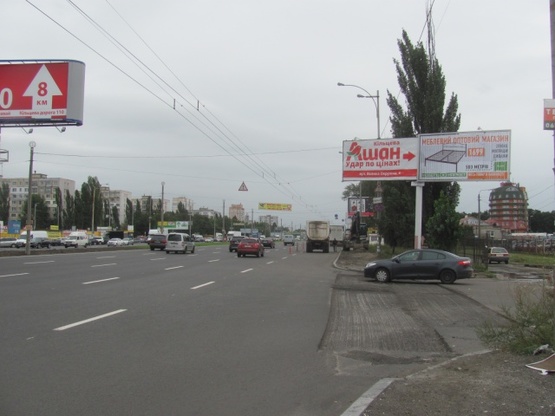 Фото рекламной плоскости по адресу Кольцевая дорога - поворот к ТЦ "АШАН" (магазин "Технополис", в направлении Софиевской Борщаговки)