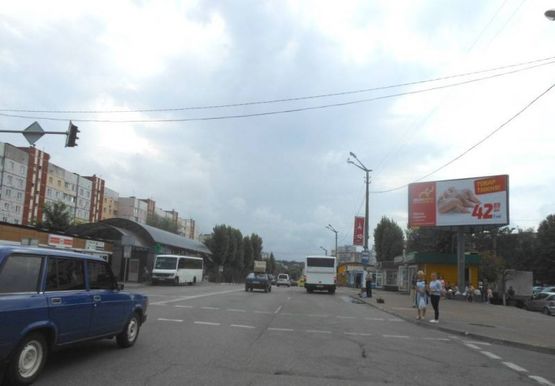 Фото рекламной плоскости по адресу м. Обухів, вул..Київська, 117, біля супермаркета "Велика кишеня"  (перед автозупинкою  "Піщана", в центр)