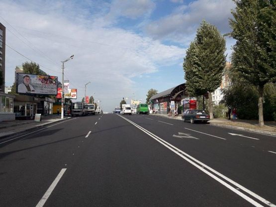 Фото рекламной плоскости по адресу м. Обухів, вул. Київська, 117, біля супермаркета "Велика кишеня" (автозупинка "Піщана")