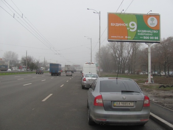 Фото рекламной плоскости по адресу Зодчих ул.,62, Кольцевая дорога (Ашан, АТБ, Новая Почта, Автоцентр, Эльдорадо)