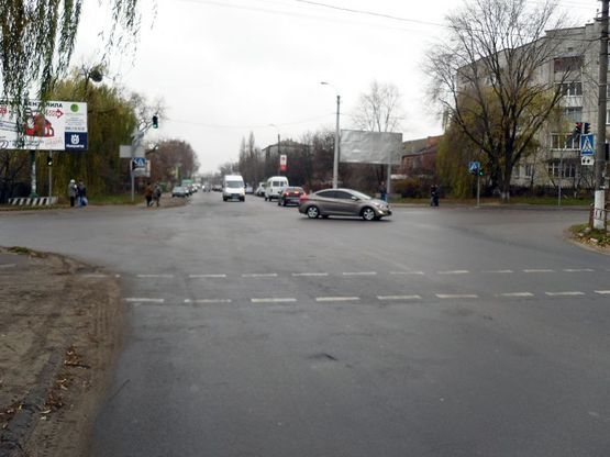 Фото рекламной плоскости по адресу Вул. Павлюченко перехрестя з вул. П.Запорожця (біля центрального базару)