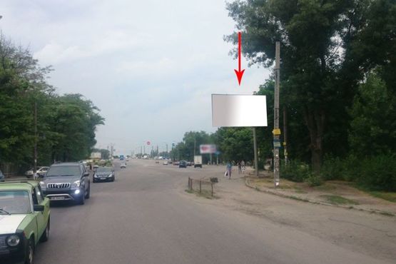 Фото рекламной плоскости по адресу 055А,вул. Любарського (Білостоцького), 19, при заїзді на віадук на просп. Слобожанський (Газ. "Правда")