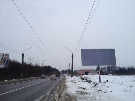 Фото рекламной плоскости по адресу В'їзд в місто, Сихівське кладовище,Автодорога  Н-09  Мукачево-Рахів-Богородчани-Івано-Франківськ-Рогатин-Бібрка-Львів, км 437+770 ліворуч