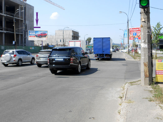 Фото рекламной плоскости по адресу Днепровская Набережная, напротив суп-та "Новус", на светофоре