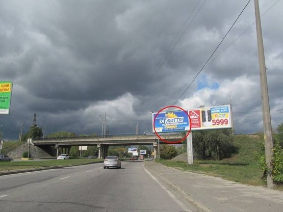 Фото рекламної площини за адресою Богатирська вул. перед мостом ліва