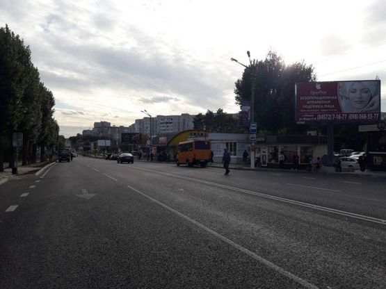 Фото рекламной плоскости по адресу м. Обухів, вул. Київська, 117, біля супермаркета "Велика кишеня" (автозупинка "Піщана")