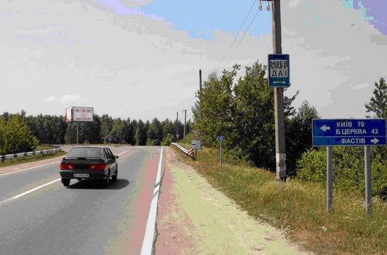 Фото рекламної площини за адресою перекресток ул. Щербакова, Окружной и дороги на Бышев (клумба) въезд с Бышева