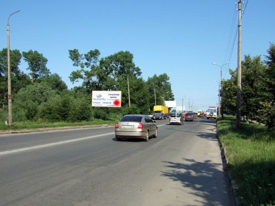 Фото рекламной плоскости по адресу вул.Прибузька - Старокостянтинівське шосе (за шиномонтажем). неподалік: автостоянка, шиномонтаж, АЗК, супермаркет "Вопак", непродовольчий ринок (від центру)