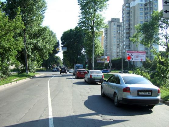 Фото рекламной плоскости по адресу перехрестя Старокостянтинівське шосе - вул.Прибузька, (шиномонтаж). неподалік: автостоянка, шиномонтаж, АЗК, супермаркет "Вопак", непродовольчий ринок (в центр)