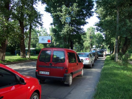 Фото рекламної площини за адресою перехрестя Старокостянтинівське шосе - вул.Прибузька (висотка). неподалік: автостоянка, шиномонтаж, АЗК, супермаркет "Вопак", непродовольчий ринок (від центру)