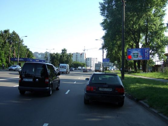 Фото рекламної площини за адресою Старокостянтинівське шосе (ТЦ "МійДім", ближній до круга). неподалік: меблевий ТЦ "МійДім", супермаркет "Сільпо", магазини автозапчастин, авторинок, автосалони "БМВ","Мерседес","Опель","Рено","Хюндай","Шкода" та інші. (в'їзд в місто, в центр)