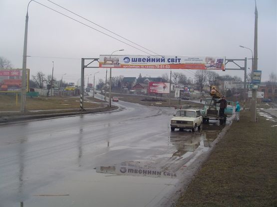 Фото рекламной плоскости по адресу розв'язка вул.Кам'янецька - вул.Толстого (зі сторони нового мосту) (в центр) "A"