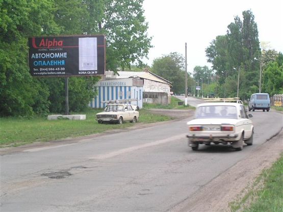 Фото рекламной плоскости по адресу вул. Михайла Грушевськогоул (вул.Жовтнева) "Шиномонтаж"