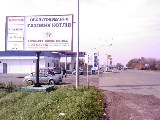 Фото рекламной плоскости по адресу вул. Лінійна, АЗС ТНК, супермаркет "КАПИ"