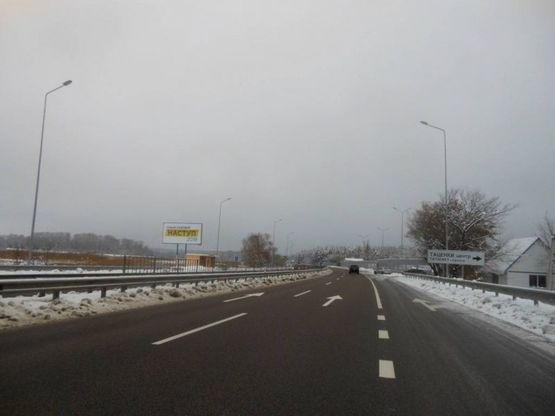 Фото рекламної площини за адресою с. Таценки, міст через р. Стугна, виїзд з Обухова