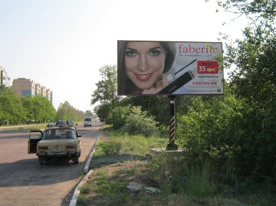 Фото рекламной плоскости по адресу пр-т К.Маркса, поворот на пр. Победы