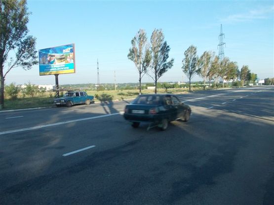 Фото рекламной плоскости по адресу ул. Днепропетровская (въезд в город)