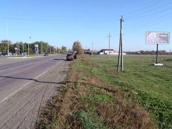 Фото рекламной плоскости по адресу Марьинское, ул. Первого мая, р-н АЗС, въезд со стороны Каховки