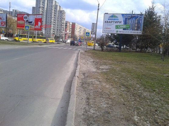 Фото рекламной плоскости по адресу Пр-т Червоної Калини-Чукаріна (поряд ТЦ ШУВАР)