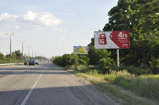 Фото рекламної площини за адресою пр-т Слобожанський - ж/м  "Золоті ключі", ТЦ "Метро", віадук, в сторону м. Дніпро