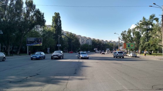 Фото рекламной плоскости по адресу пр-т Героїв, б. 12, "китайська стіна" (в центр)