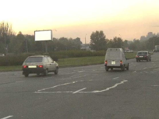 Фото рекламной плоскости по адресу Набережна магістраль - вул.Українська (коло), напрямок руху до порту