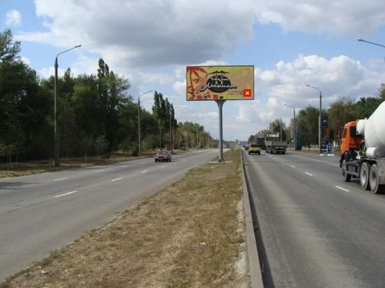 Фото рекламної площини за адресою Набережна магістраль - Вознесенівський ринок (автомойка «Кристалл»), напрямок руху до порту