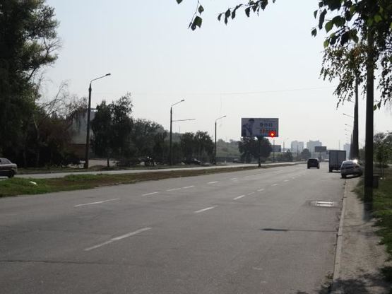 Фото рекламної площини за адресою Набережна магістраль - Вознесенівський ринок, напрямок руху до вокзалу