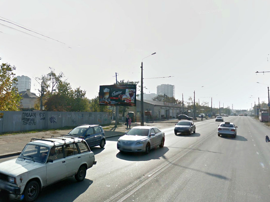 Фото рекламной плоскости по адресу Комарова - завод "Промсвязь"