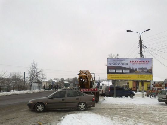 Фото рекламной плоскости по адресу смт. Отинія, ринок (напрям на Чернівці)