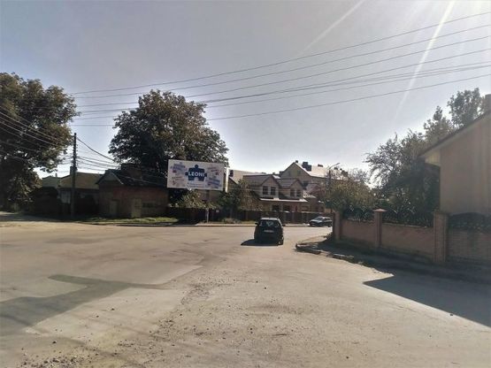 Фото рекламной плоскости по адресу вул. Петлюри (автосервіс "Спафіс"), напрям в центр