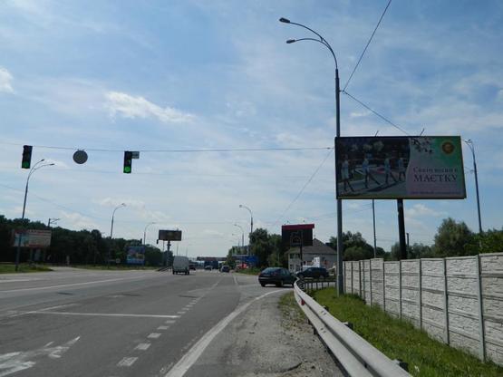 Фото рекламной плоскости по адресу Новообуховская трасса 20+780 справа из Киева