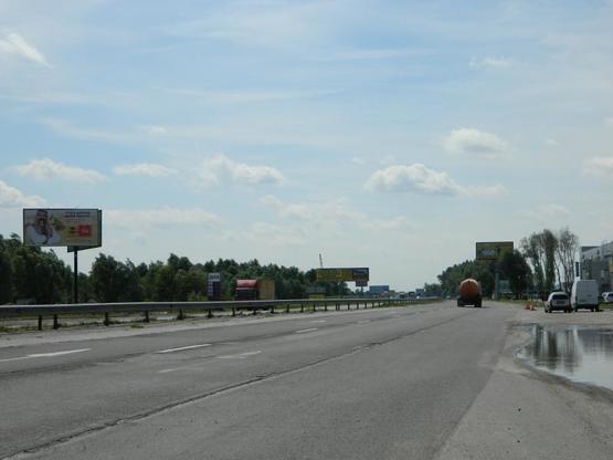 Фото рекламної площини за адресою Новообуховская трасса 23+700 слева из Киева