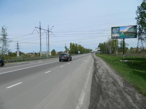 Фото рекламной плоскости по адресу Киев-Иванков-Овруч 20+400 справа из Киева