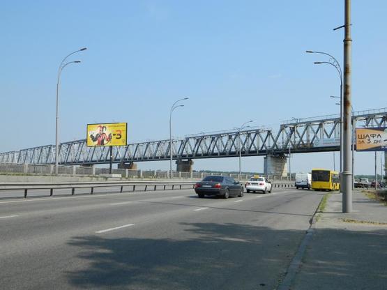 Фото рекламної площини за адресою Набережнo-Рыбальская ул. , 75 м от ж/д моста от пр. Московский