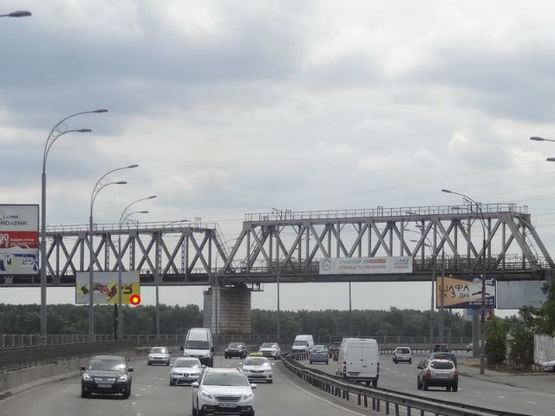 Фото рекламной плоскости по адресу Набережнo-Рыбальская ул. , 75 м от ж/д моста от пр. Московский