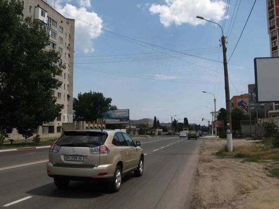 Фото рекламной плоскости по адресу ул. 1-го Мая,- ул. Карла Маркса, Въезд в Ильичёвск, часть МЧС, заправка "Свикон"