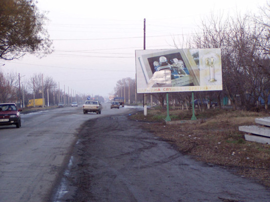 Фото рекламной плоскости по адресу пр.Суворова-ул. М.Жукова, пр.Суворова угол ул. М.Жукова, Автомаркет, по движению к ТЦ "Таврия-В"