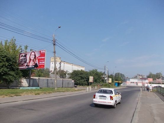 Фото рекламної площини за адресою Белая ул., 50 м. к Старицкого ул. из центра.