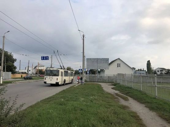 Фото рекламной плоскости по адресу вул. Героїв Чорнобиля перехрестя з вул. Дружби (стадіон БДАУ ., напр. до м-ну АТБ) сторона А