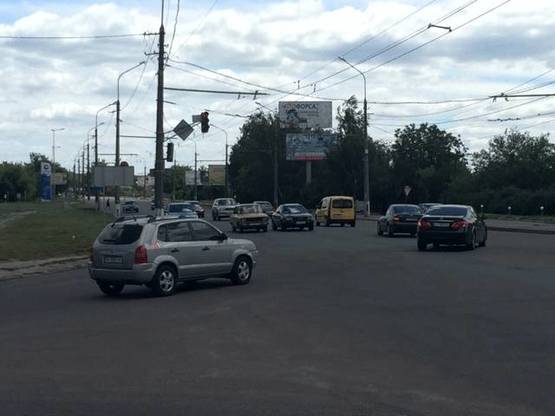 Фото рекламной плоскости по адресу вул. Кн. Володимира перехрестя з вул.Шевченко верхній (напрямок з центру) + ПОКЛЕЙКА З ВИШКИ
