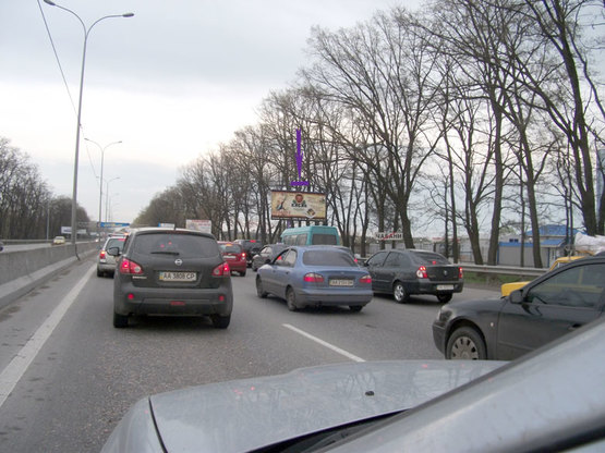 Фото рекламной плоскости по адресу Одеська траса, 1000 м до Нової Лінії, у напрямку Києва