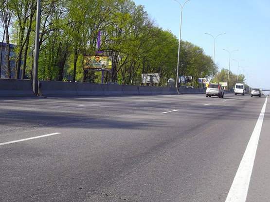 Фото рекламной плоскости по адресу Одеська траса, 1000 м до Нової Лінії, у напрямку Одеси