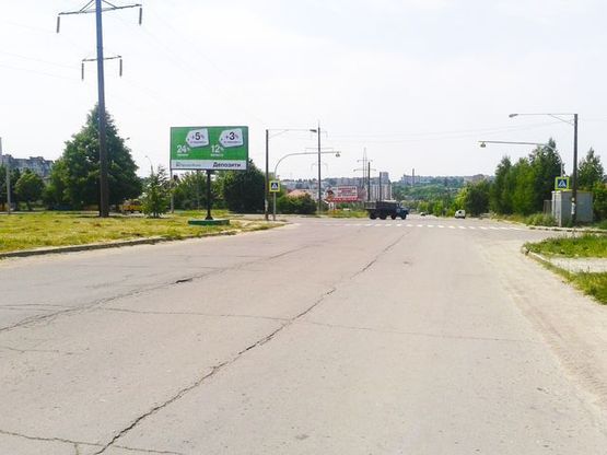 Фото рекламної площини за адресою Бандери С.ул. - Мирного П. ул., (напротив Магазин "Еліткераміка",ТЦ "Планета Меблів",продуктовий ринок)