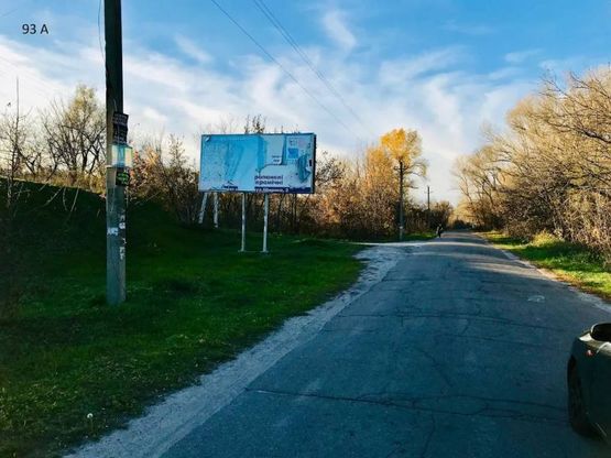 Фото рекламной плоскости по адресу смт.Карнаухівка, вул.Рибальська, навпроти зупинки