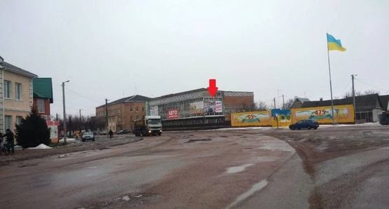 Фото рекламної площини за адресою ул. Ленина,2, центр, универмаг, напротив "Вопак", правая, в напр. на Житомир