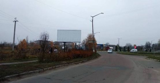 Фото рекламной плоскости по адресу ул. Гагарина, напротив проходной бумажной фабрики, возле моста, из центра